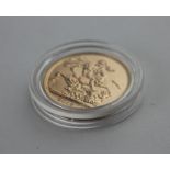 A 2015 Elizabeth II gold sovereign, in capsule.