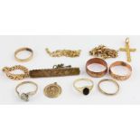 A collection of gold jewellery, to include; A 22ct. yellow gold cross, with engraved decoration to