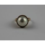 A 14ct. gold and pearl ring, set large cultured pearl (diameter approx. 13mm), shank impressed "