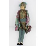 **REOFFER IN APR LONDON 50/80**An early 20th century Indian cloth doll, an unusual length wearing