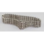 **VENDOR COLLECTED THE LOT ON 14/02/19**An 18ct. white gold and four strand diamond bracelet, formed