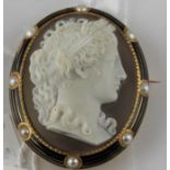 An early 20th century Continental yellow metal and agate cameo brooch, of ovoid form, the agate