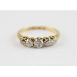 An 18ct. yellow gold and five stone diamond ring, set row of graduated old cut diamonds, shank