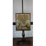 A c19th mahogany firescreen with original Berlin woolwork panel