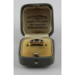 An 18ct. gold and sapphire ring, set three graduated round cut blue sapphires, shank hallmarked