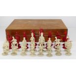 A late 19th century Cantonese export carved ivory chess set, one half natural, the other half