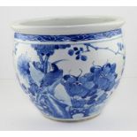 A 19th century Chinese blue and white large jardiniere decorated with an exotic bird looking up