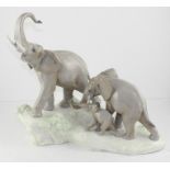 A Lladro porcelain group 'Elephants walking', printed mark, 40 cm wide