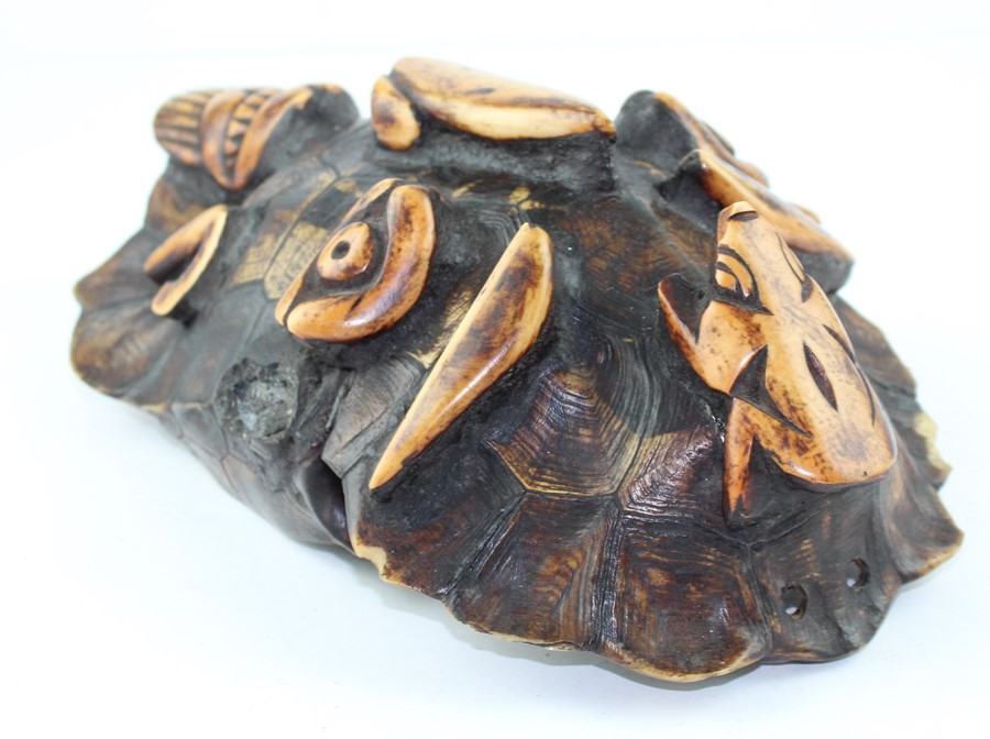 19th century tortoiseshell and stained bone tribal mask,  carved in relief with a face, 28 cm x 18 - Image 3 of 4