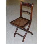 **VENDOR WILL COLLECT THE LOT**A Regency mahogany folding 'Campaign' type chair, having reeded and