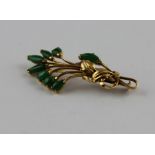 A yellow metal and jadeite floral spray brooch, the open work floral spray having engraved leaves