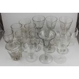 A collection of eighteen 18th, 19th century and later wine glasses to include an air twist stem wine