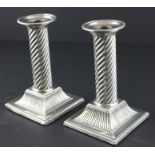 A pair of Victorian silver candlesticks, by Rupert Favell, assayed London 1861, each having