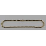 A 14ct. yellow gold choker necklace, lobster claw clasp, impressed "14kt" and "585", length 40.5 cm.