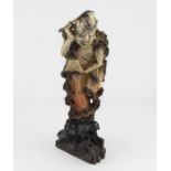 A 19th century Chinese soapstone carving of a 'demonic' figure, 35 cm high THE SELLER COLLECTED