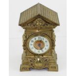 Late 19th century French brass mantle clock, with enamel dial, arabic numerals within a pierced case