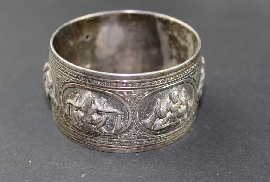 A set of twelve Cambodian silver place name/menu holders, of square form, repousse decorated flowers - Image 3 of 4