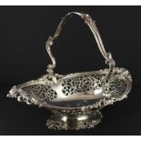 A Victorian silver swing handled pedestal basket, by Henry Wilkinson & Co, assayed Sheffield 1855,