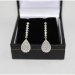 **VENDOR COLLECTED THE LOT ON 14/02/19**A Pair of 18ct. white gold and diamond drop earrings, the