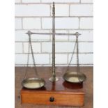 **REOFFER IN APR LONDON 30/50**A late 19th century mahogany and brass set of beam scales, with two