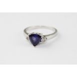 **REOFFER IN APR LONDON 120/180**A tanzanite and diamond 18ct white gold ring, the trillion cut