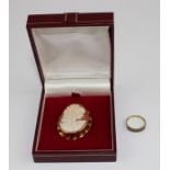 A 9ct. gold mounted cameo brooch, the shall cameo carved with a profile bust of a young lady looking