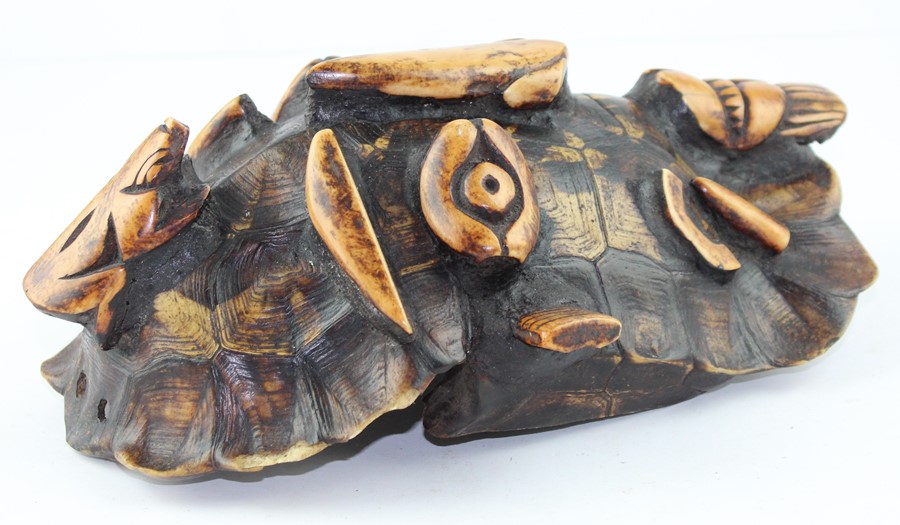 19th century tortoiseshell and stained bone tribal mask,  carved in relief with a face, 28 cm x 18 - Image 2 of 4