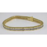 **VENDOR COLLECTED THE LOT ON 14/02/19**An 18ct. yellow gold and diamond bracelet, in the Tennis