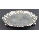 A silver circular card tray, by Goldsmiths & Silversmiths Company Ltd, assayed London 1911, having