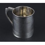 A George 111 silver christening mug, of plain tapering form with reeded bands, London 1801