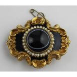 **REOFFER IN APR LONDON 180/220**A Victorian yellow metal, black enamel, onyx and seed pearl