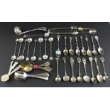 A matched set of nine Moroccan silver coffee spoons, having milled coin bowls, wrythen stems and