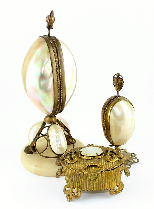 WITHDRAWN-Two abalone shell boxes one a watch stand the other a necessaire and similar pressed brass