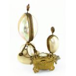 WITHDRAWN-Two abalone shell boxes one a watch stand the other a necessaire and similar pressed brass