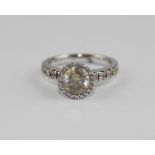 **VENDOR COLLECTED THE LOT ON 14/02/19**An 18ct. white gold and diamond halo ring, set central round