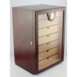 A Modern Humidor fitted with seven pull out drawers, containing eleven Cohiba cigars, six Torano and