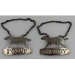 A scarce pair of Scottish silver decanter labels fashioned in the form of hunting hounds, by J.