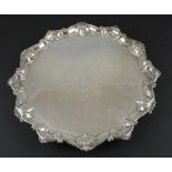 An early George III circular silver salver, by Richard Rugg I, assayed London 1762, having shell and