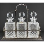 A modern silver three bottle decanter stand, by C J Vander Ltd, assayed Sheffield 1999-2000, holding