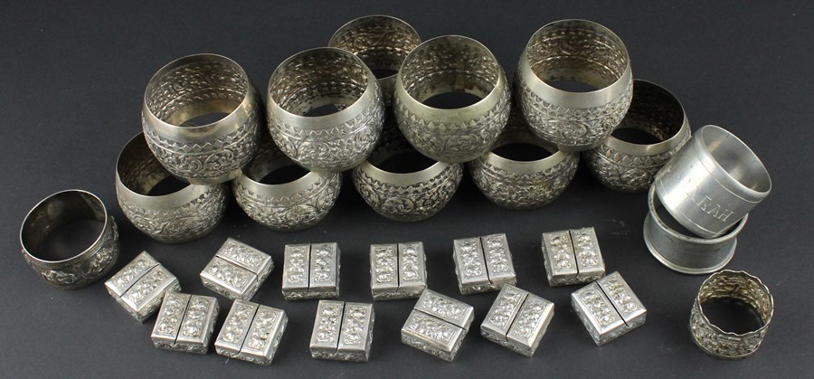 A set of twelve Cambodian silver place name/menu holders, of square form, repousse decorated flowers - Image 2 of 4