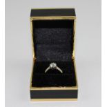 An 18ct. gold and solitaire diamond ring, (diamond weight approx. 0.7 carats)