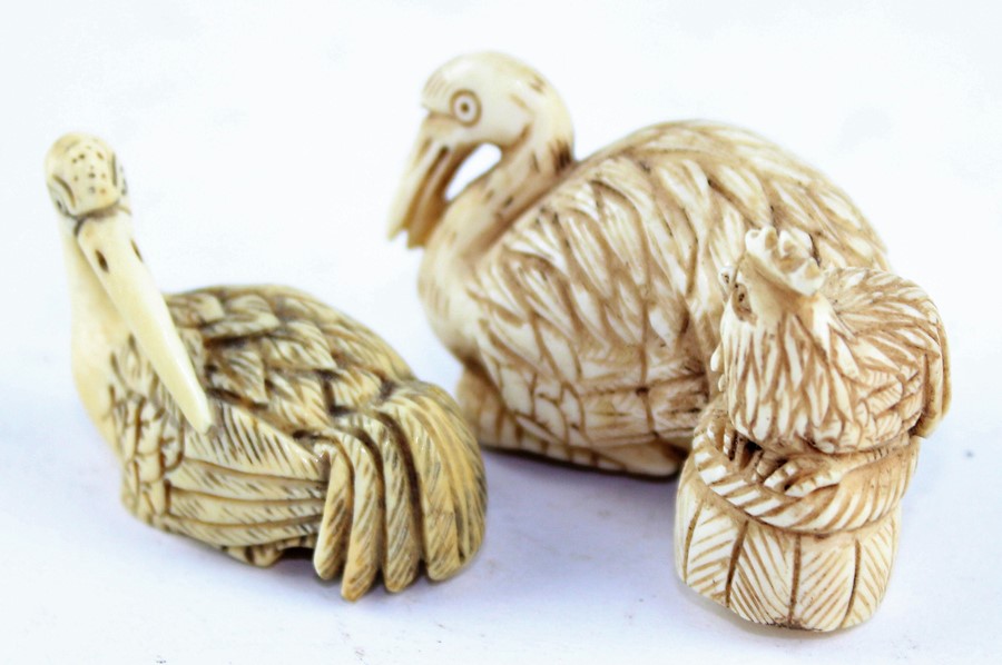 Japanese Meiji Period (1868-1912) ivory netsuke, realistically carved as a crane alongside a hen - Image 2 of 4