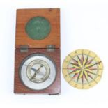 A wooden cased pocket compass and sundial 7.5 cm