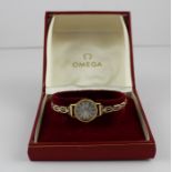 An Omega Geneve gold plated ladies' wrist watch, manual movement, having silvered circular dial with