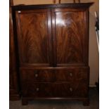A George III mahogany linen press, the cornice with plain dentil moulding and fretwork detail,