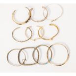 A collection of ten silver bangles/cuffs including hammer, rope, stone set and gold plated versions,