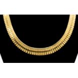 An 18ct gold fringe collar necklace, textured and polished details, length approx 17'',