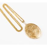 ***AUCTIONNER TO ANNOUNCE THE 15CT GOLD CHAIN HAS A 9CT GOLD BOLT CLASP****A 9ct gold oval locket,