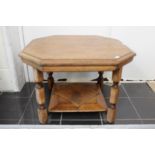 An early 20th Century oak occasional table, of octagonal form,