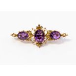 An Edwardian amethyst and seed pearl brooch,